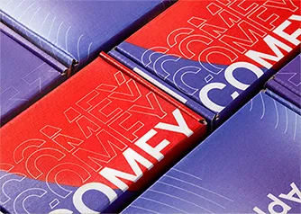Grid of custom printed purple and red mailer boxes with bold typography