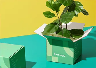 Custom red branded shipping boxes one open and one closed in studio shot