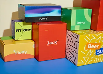 Collection of Packwire custom printed shipping boxes showcasing diverse branded RSC designs