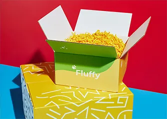 Packwire custom yellow shipping box open with crinkle paper fill